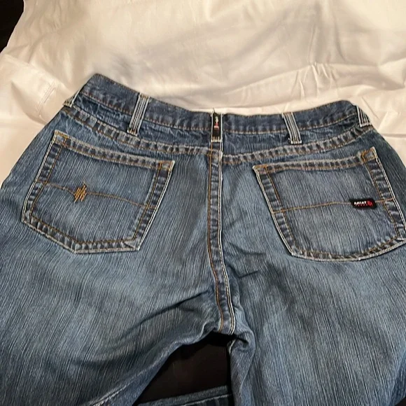 2 pairs of Arita low rise M4 boot jeans that are not hemmed